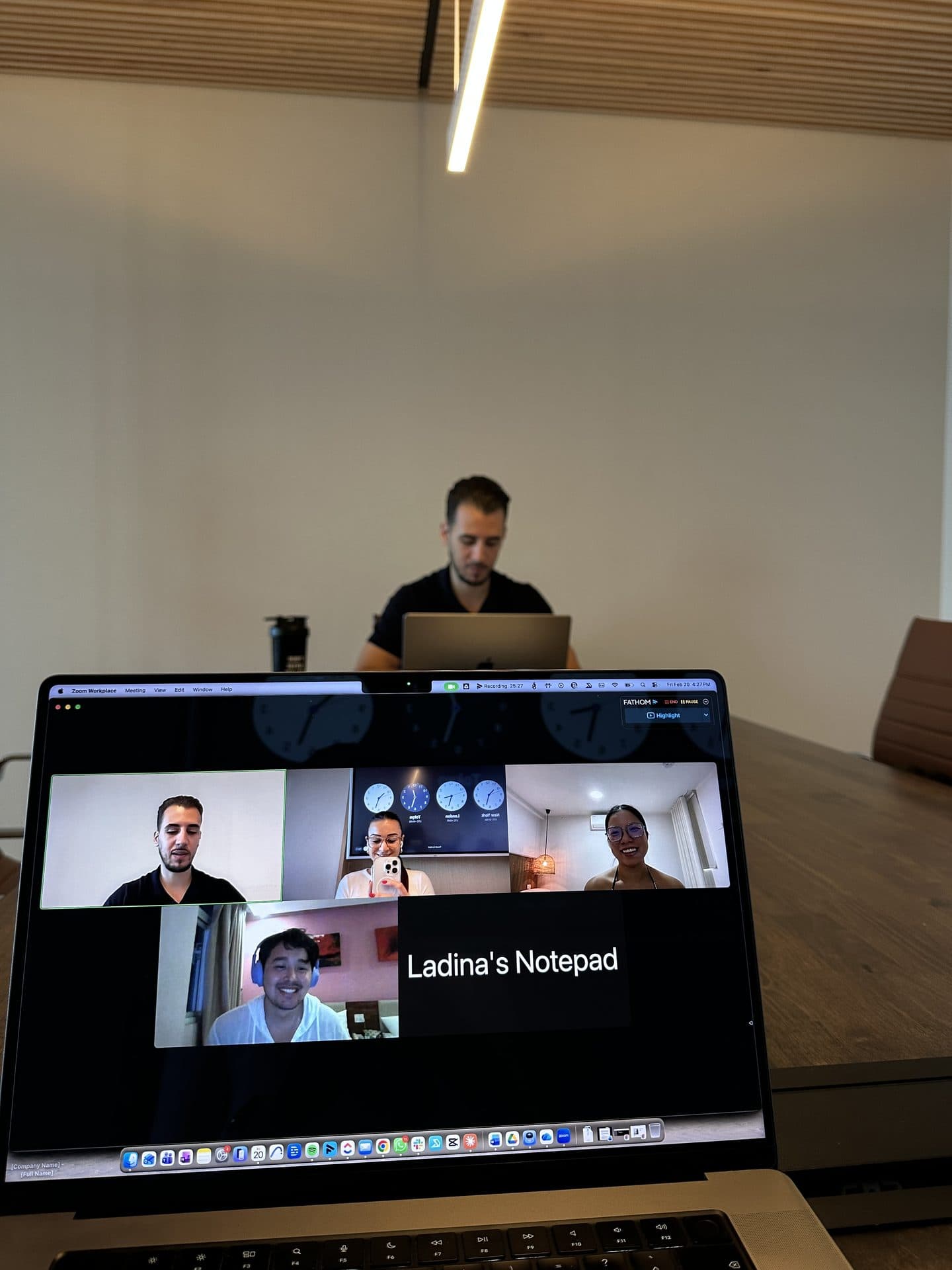 A weekly account call running on a laptop with the team on screen